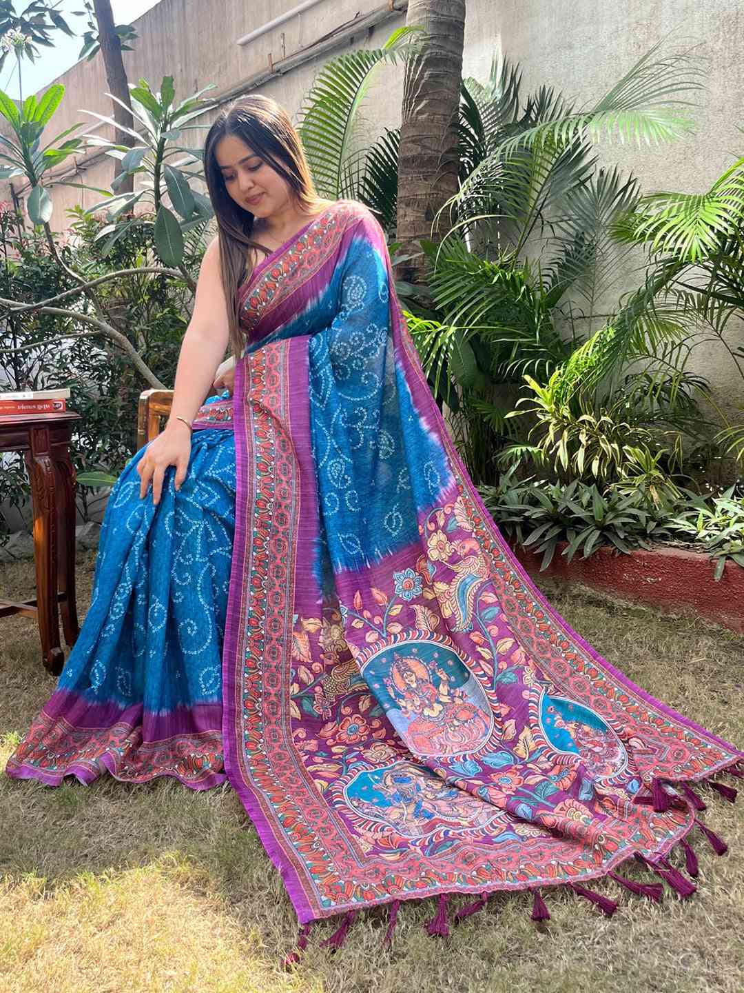 Sitting pose in blue saree with Bandhej and Kalamkari design