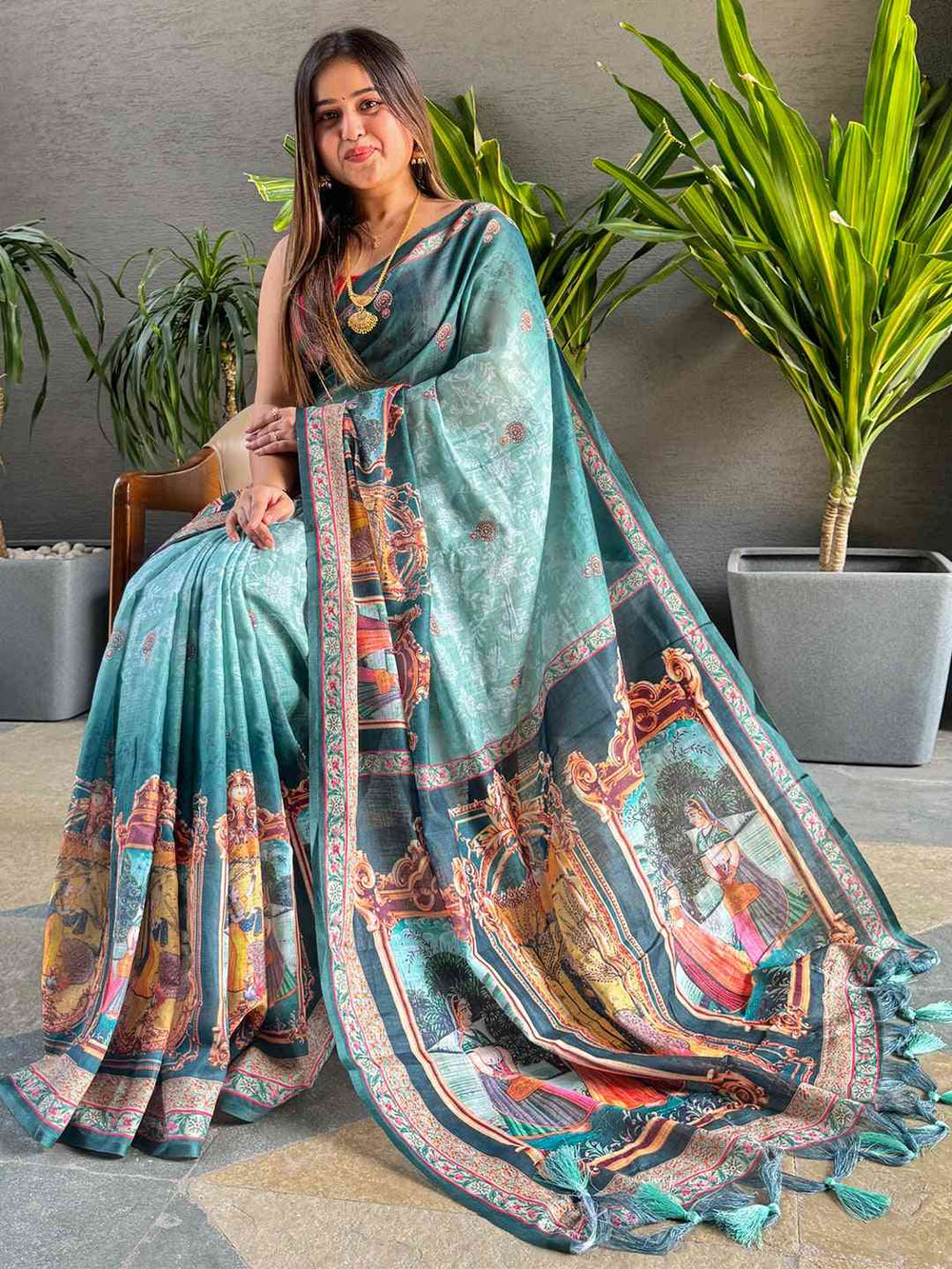 Turquoise linen saree with digital print and majestic border