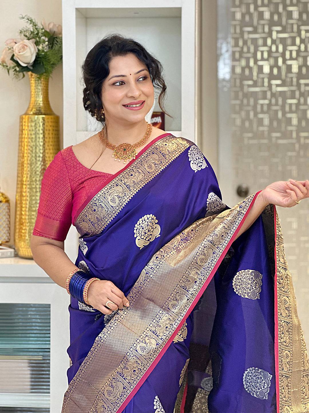 Purple Banarasi silk saree with Kanchi zari work, worn by a woman.Vastranand 