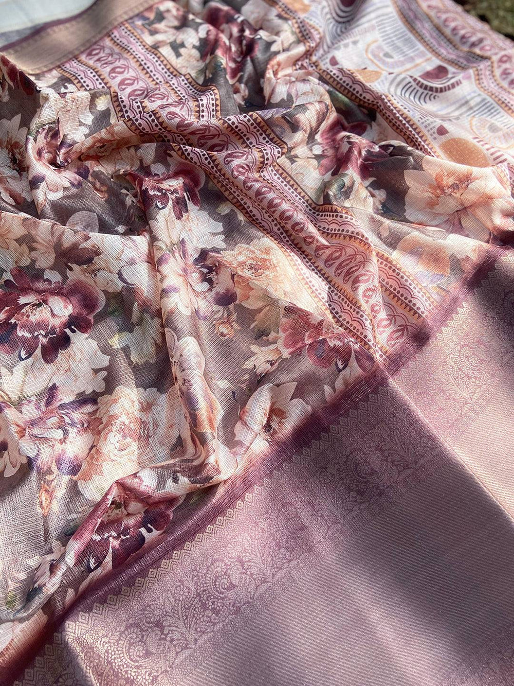 Close-up of Olive Kota Doriya saree with intricate floral pattern
