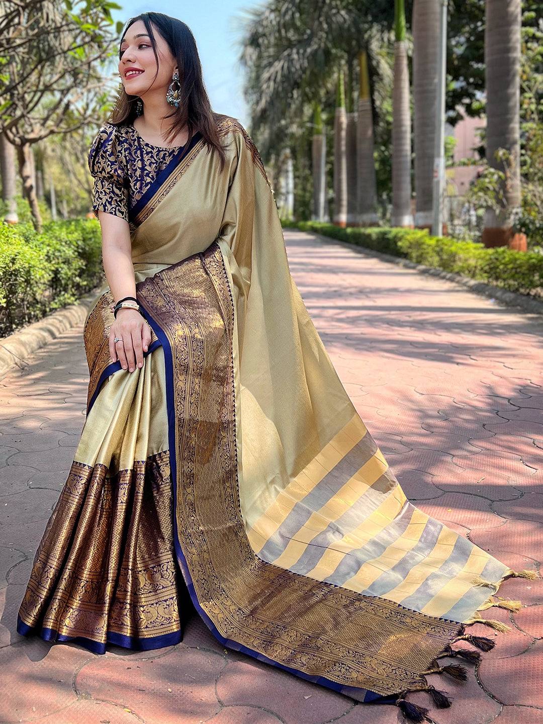 Olive Kanjivaram saree with luxurious gold and blue accents