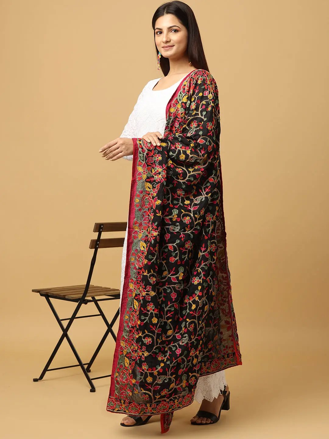 Side view of black chiffon dupatta showcasing intricate threadwork.