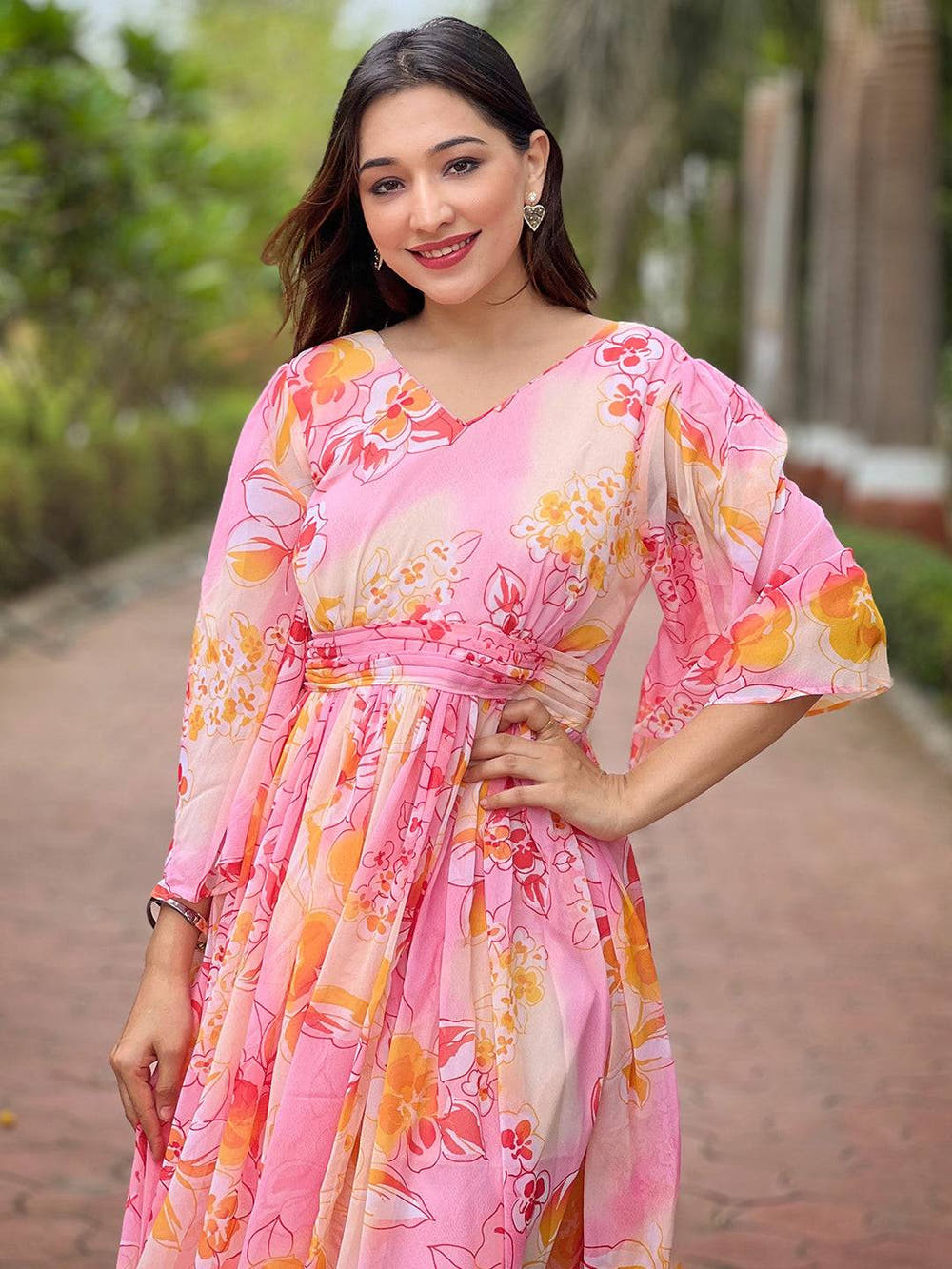 Close-up of peach abstract printed dress with V-neck