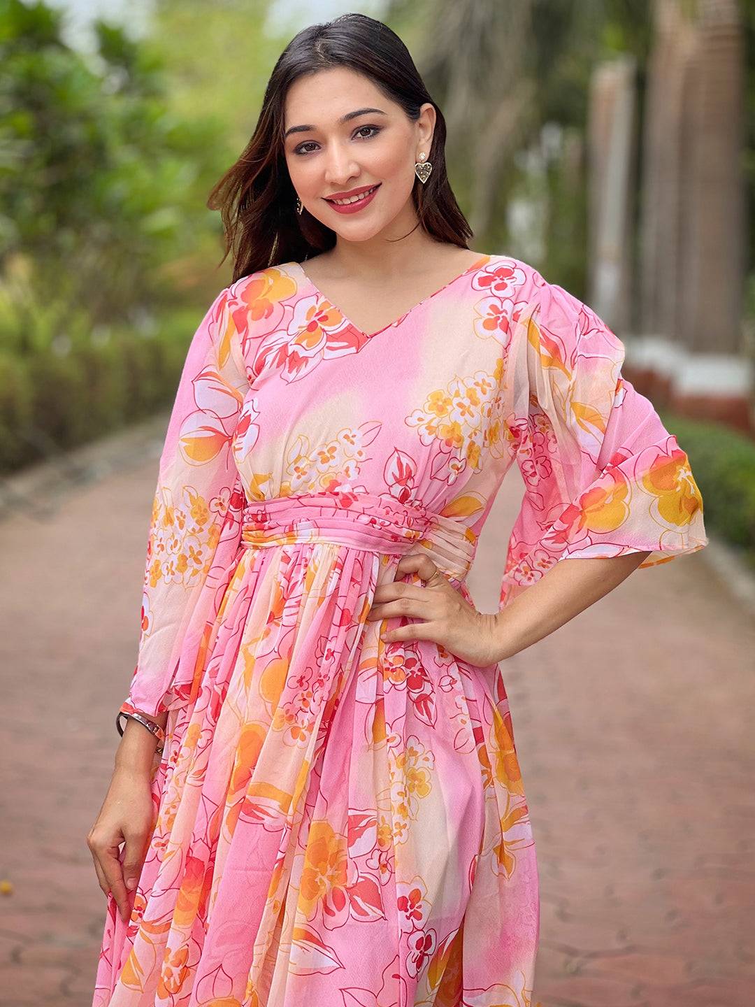 Close-up of peach abstract printed dress with V-neck
