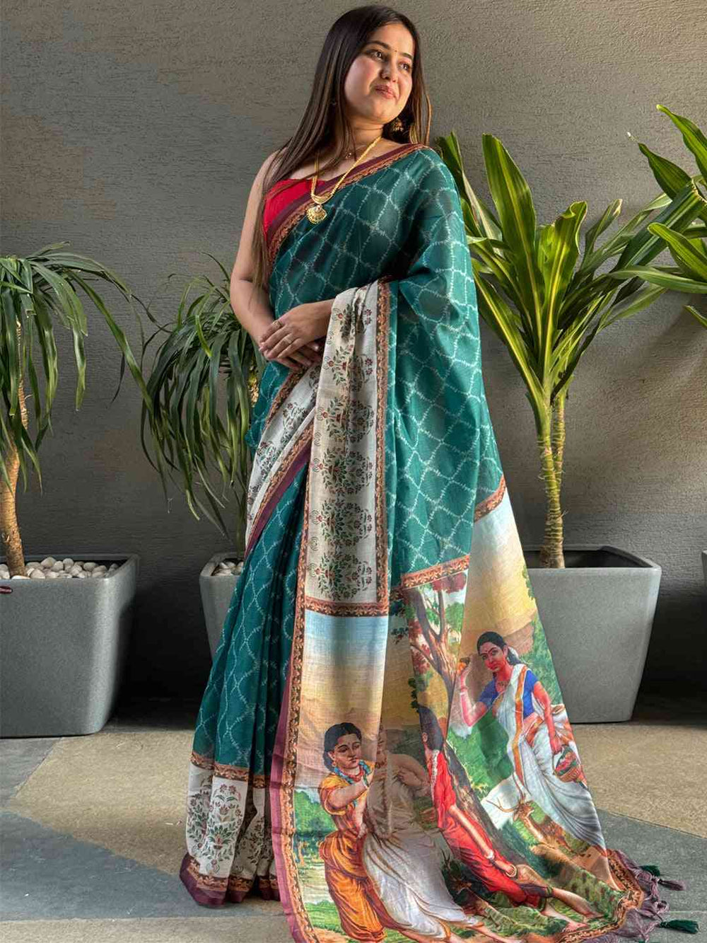 Teal Ikkat saree with kalamkari design, side view