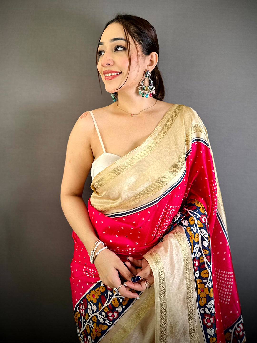Radiant Bandhej Print Dola Silk Saree