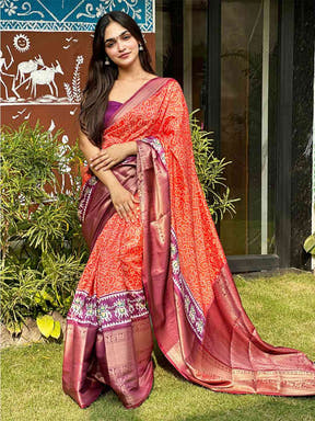 Stylish orange Bandhej silk saree featuring Pattu Zari border