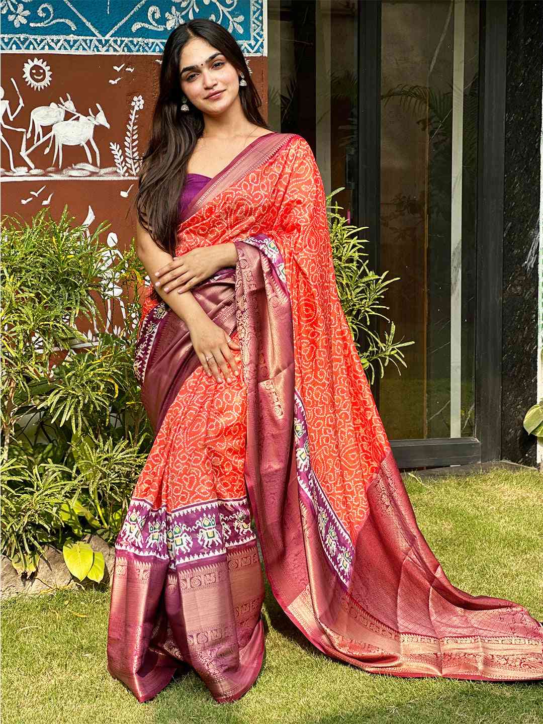 Stylish orange Bandhej silk saree featuring Pattu Zari border