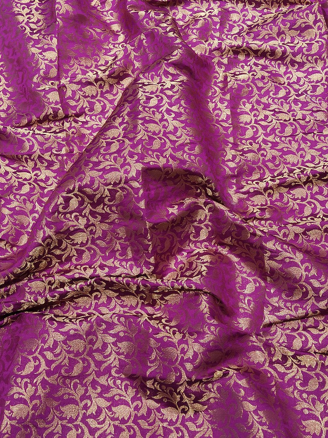 Close-up of pink Kanjivaram saree with gold floral design