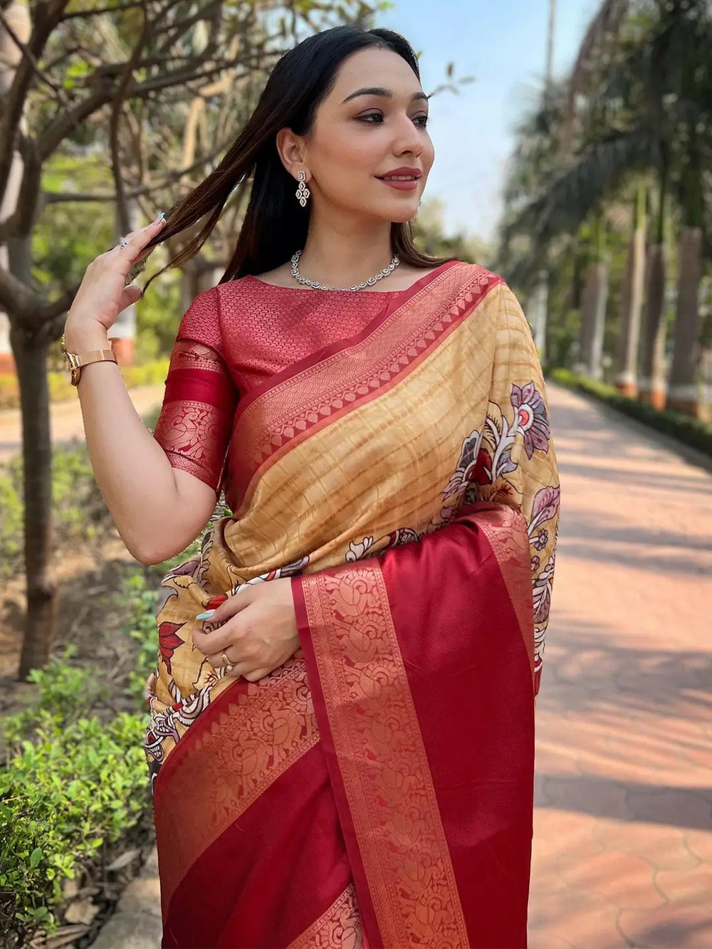 Mustard Banarasi saree with red border, perfect for special occasions.
