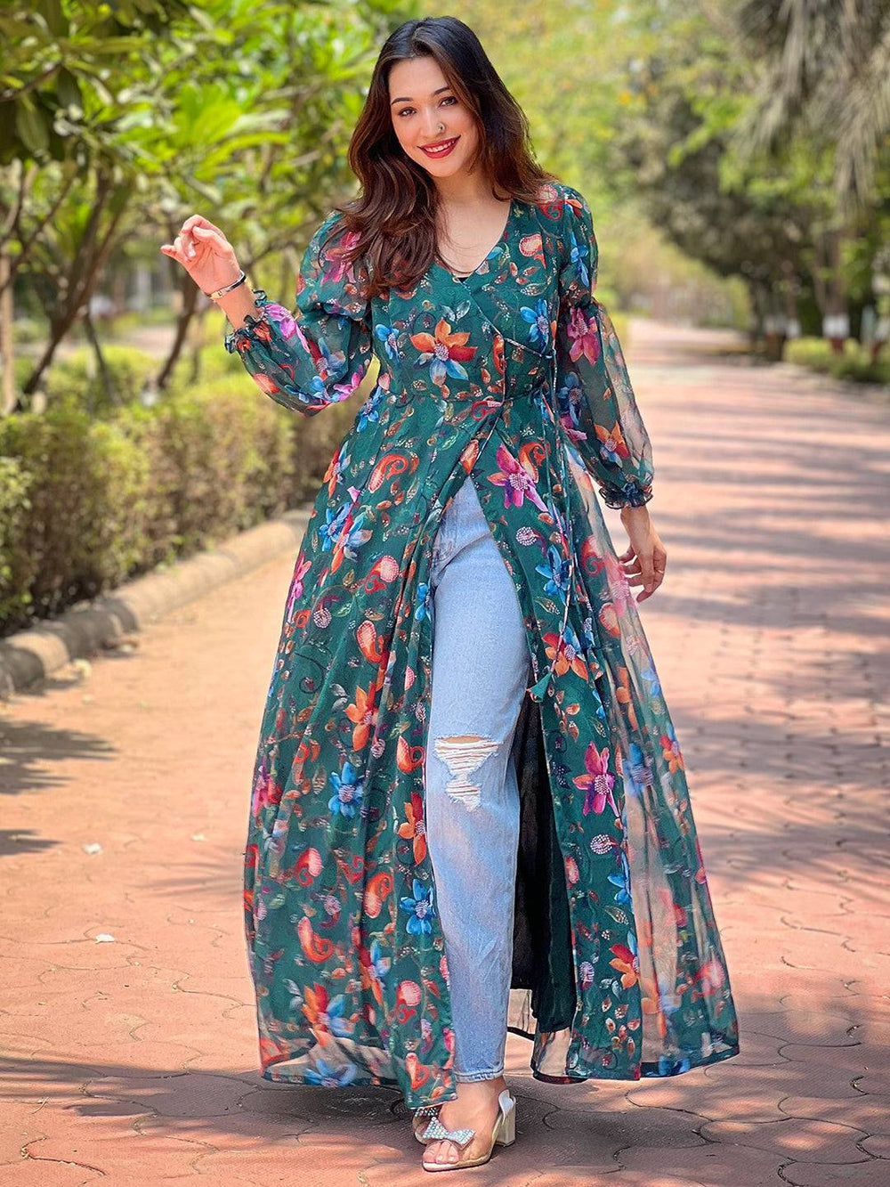 Model in dark green floral angarakha dress and jeans