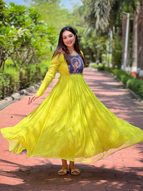 Elegant Pea Green Bandhej Dress in garden setting