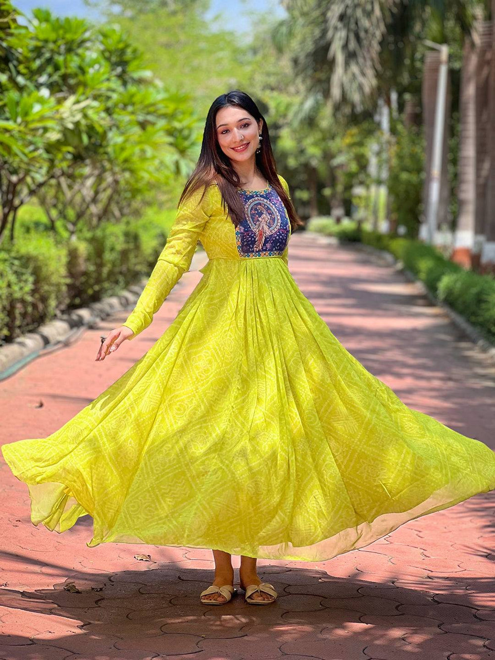 Elegant Pea Green Bandhej Dress in garden setting