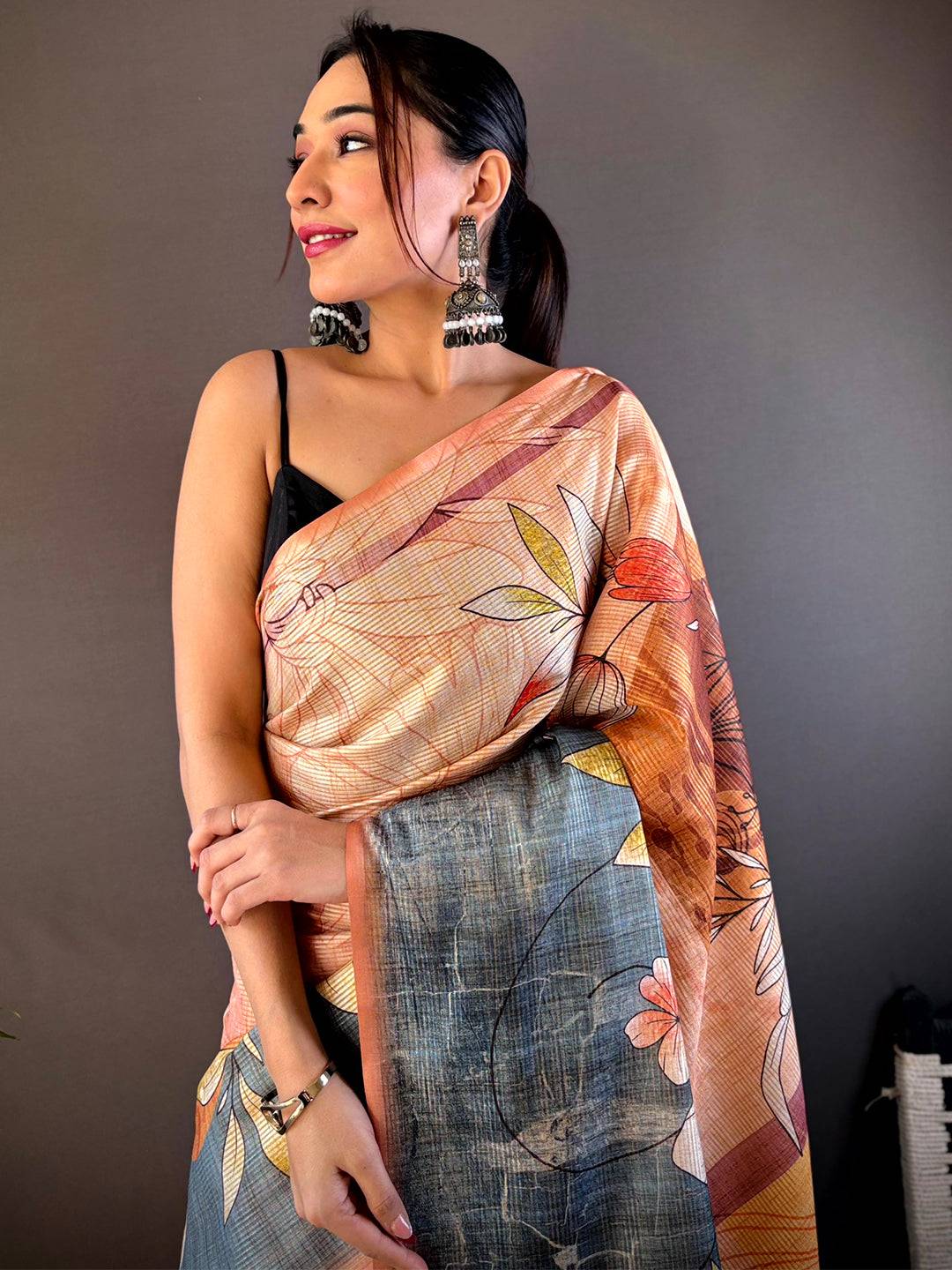 Light Orange Semi Zari Tussar Floral Saree draped elegantly