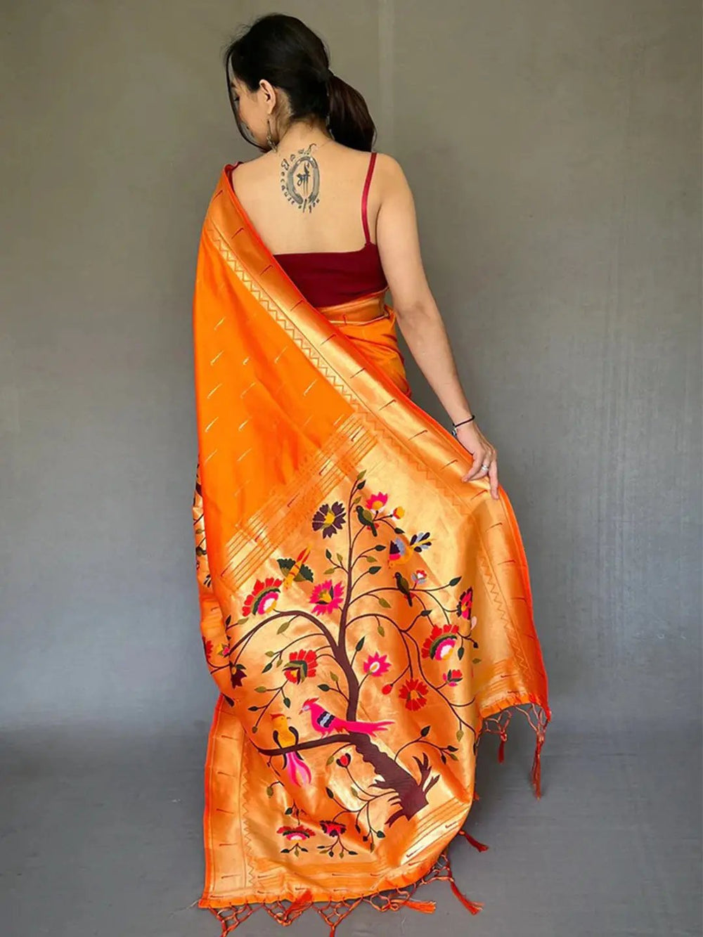 Back view of orange Paithani saree with intricate design