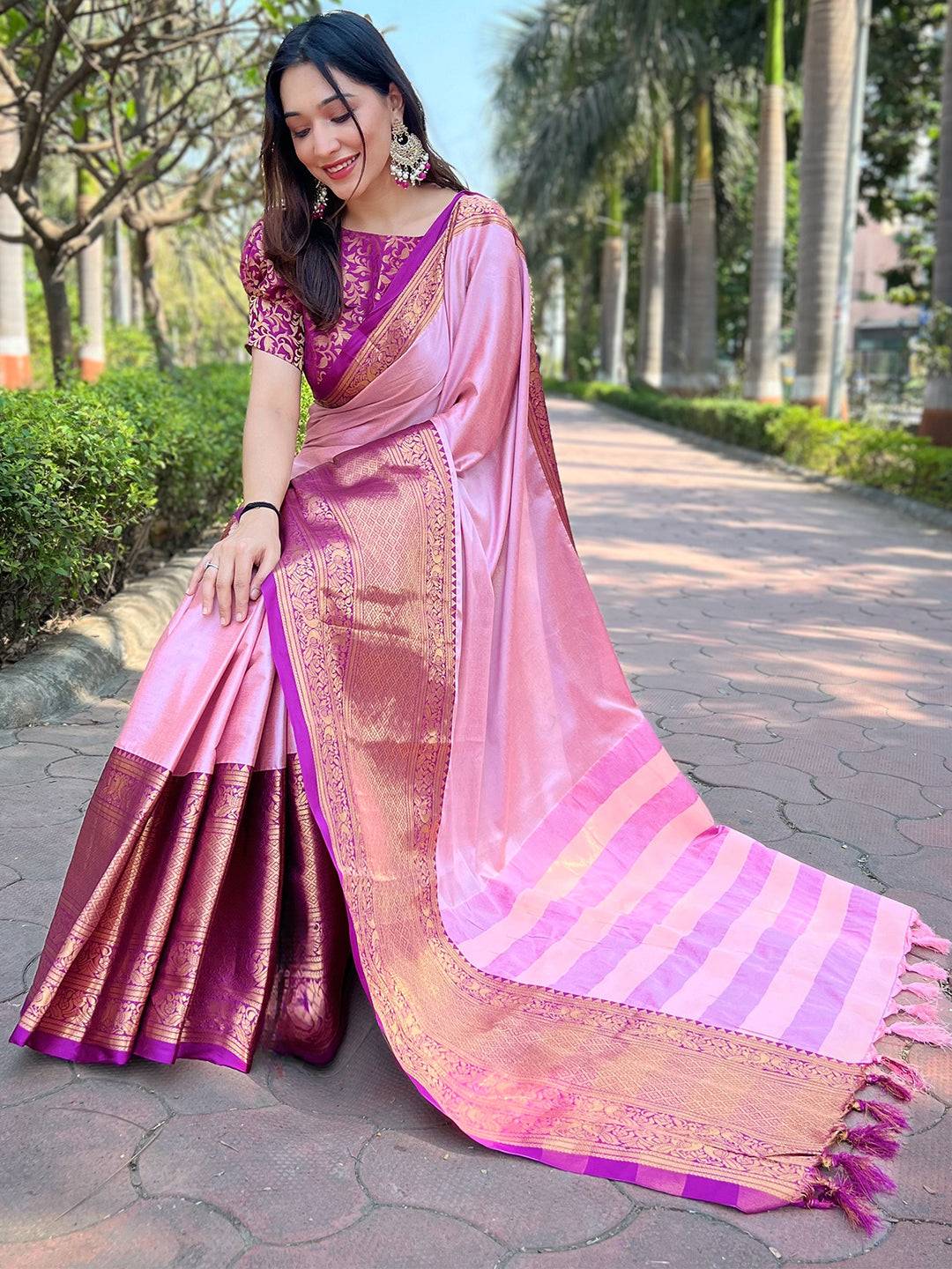 Luxurious pink saree with Kanjivaram weaving and gold accents