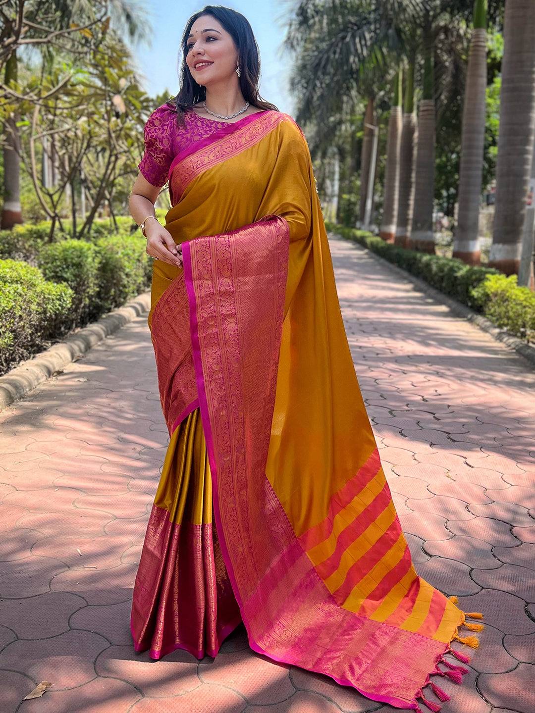 Aura mustard silk saree with intricate pink Kanjivaram weaving