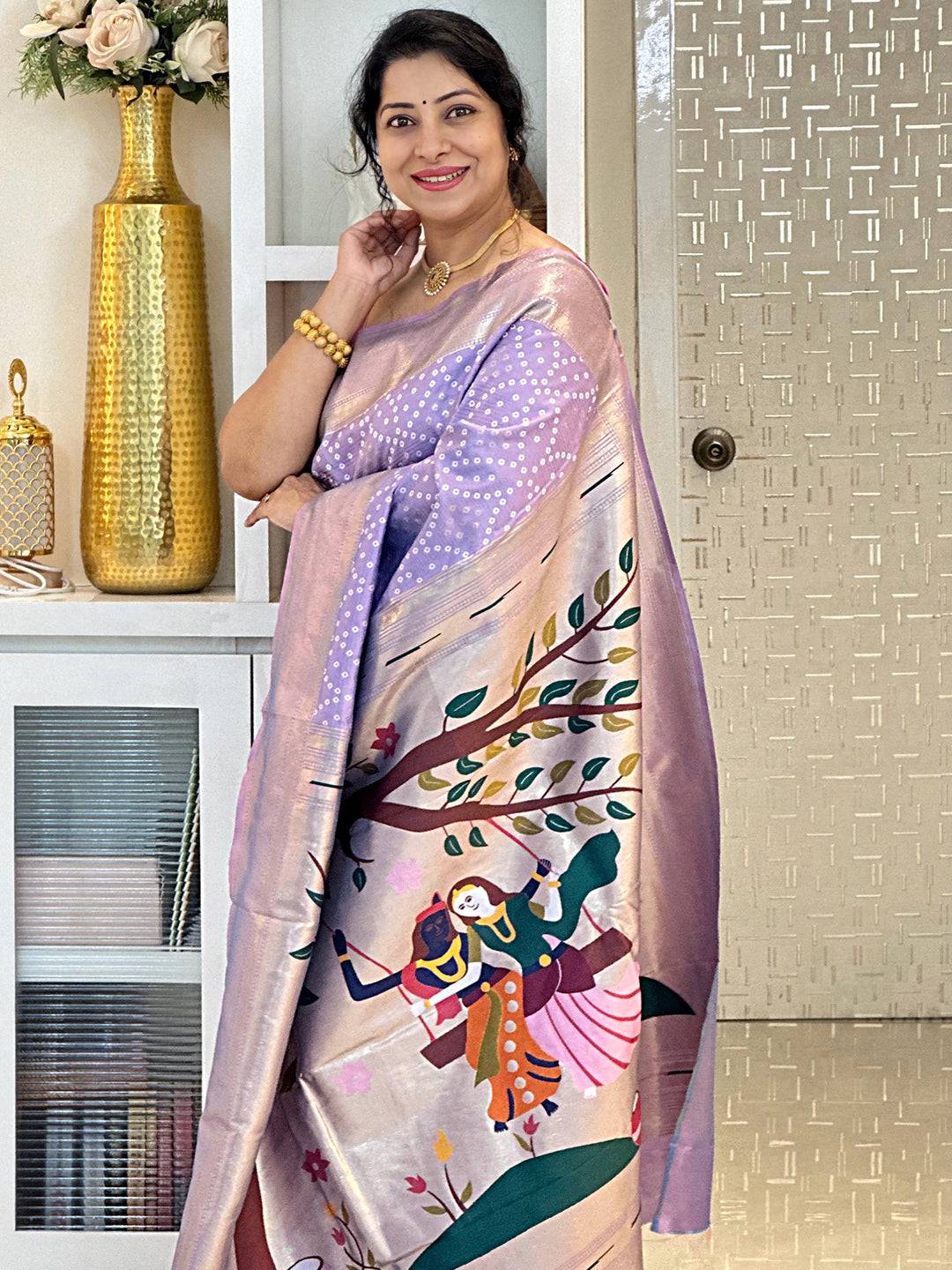Lavender silk Bandhej saree featuring artistic weaving.
