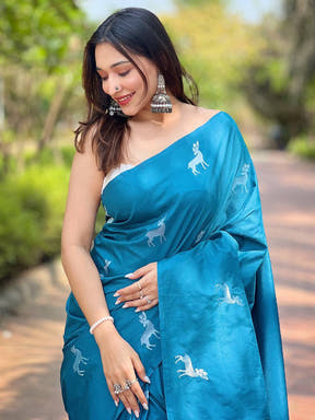 Woman in Rama soft silk saree with deer motifs