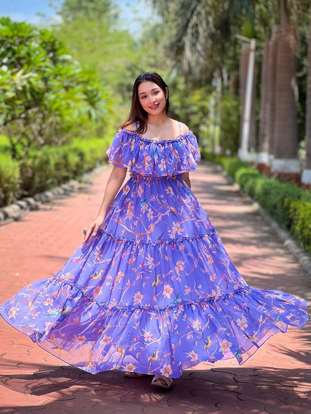 Model twirling in Purple Martini Floral Maxi Dress