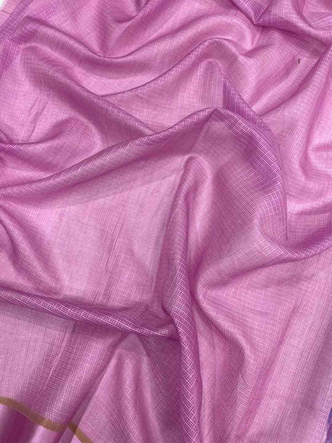 Close-up of pink satin Kota Doriya fabric with subtle texture