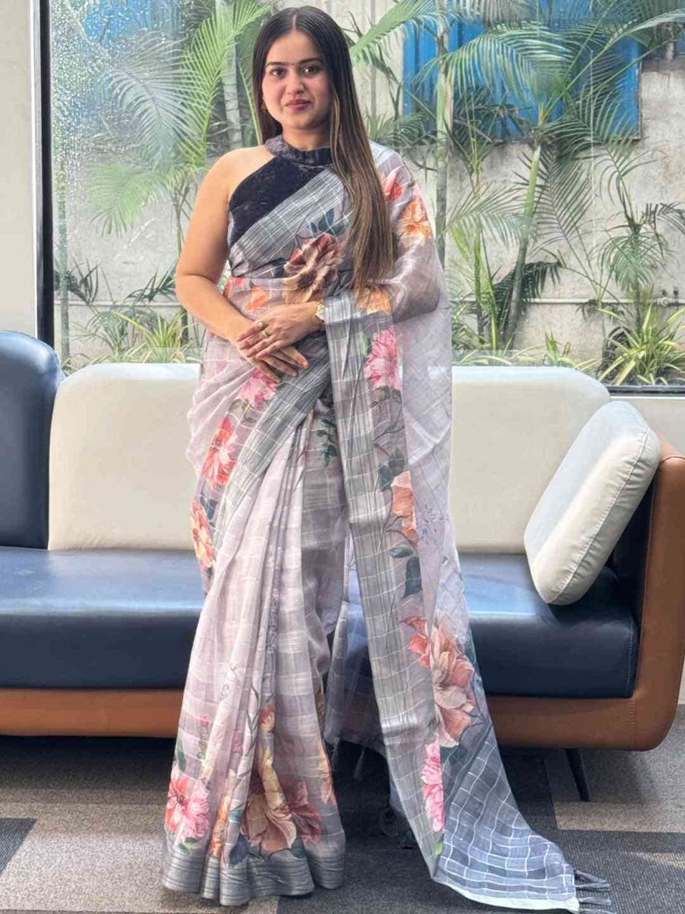 Elegant grey saree with floral motifs and zari chex pattern
