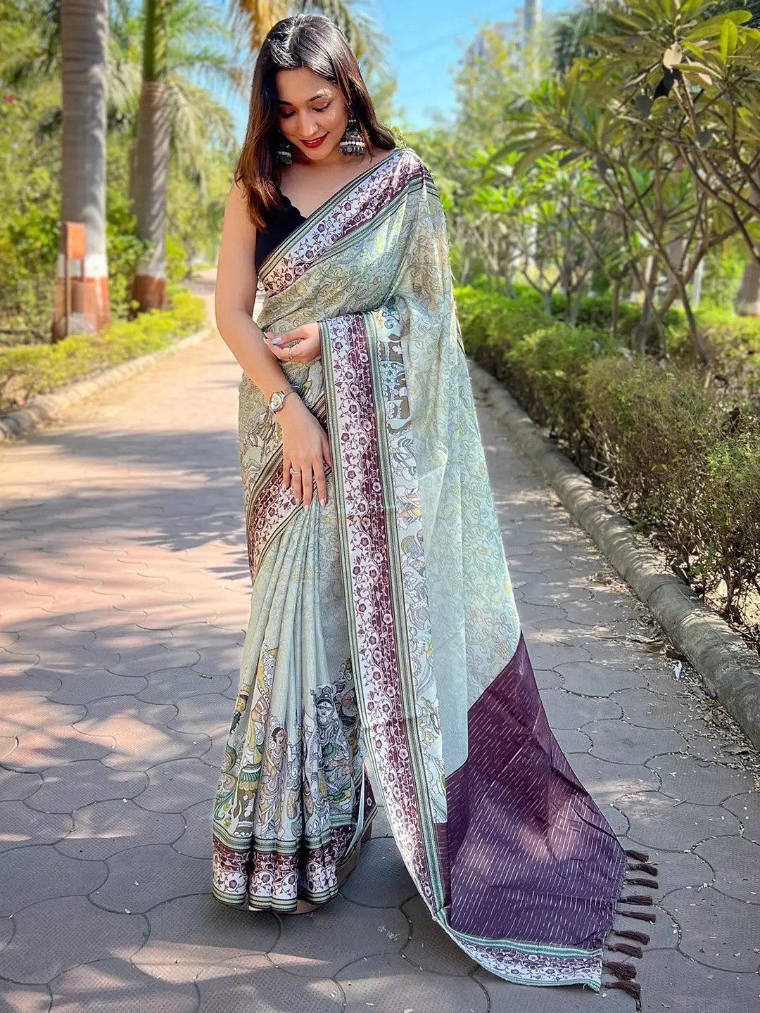 Model wearing Pista Satin Kota Doria Saree with Kalamkari print