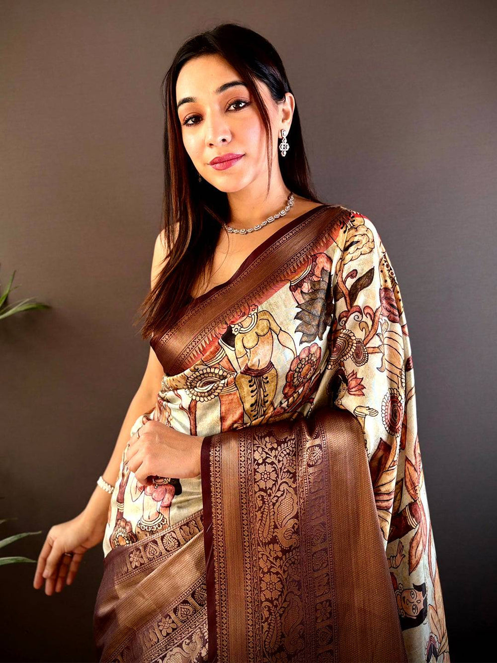Regal brown soft silk saree with intricate pattu zari border