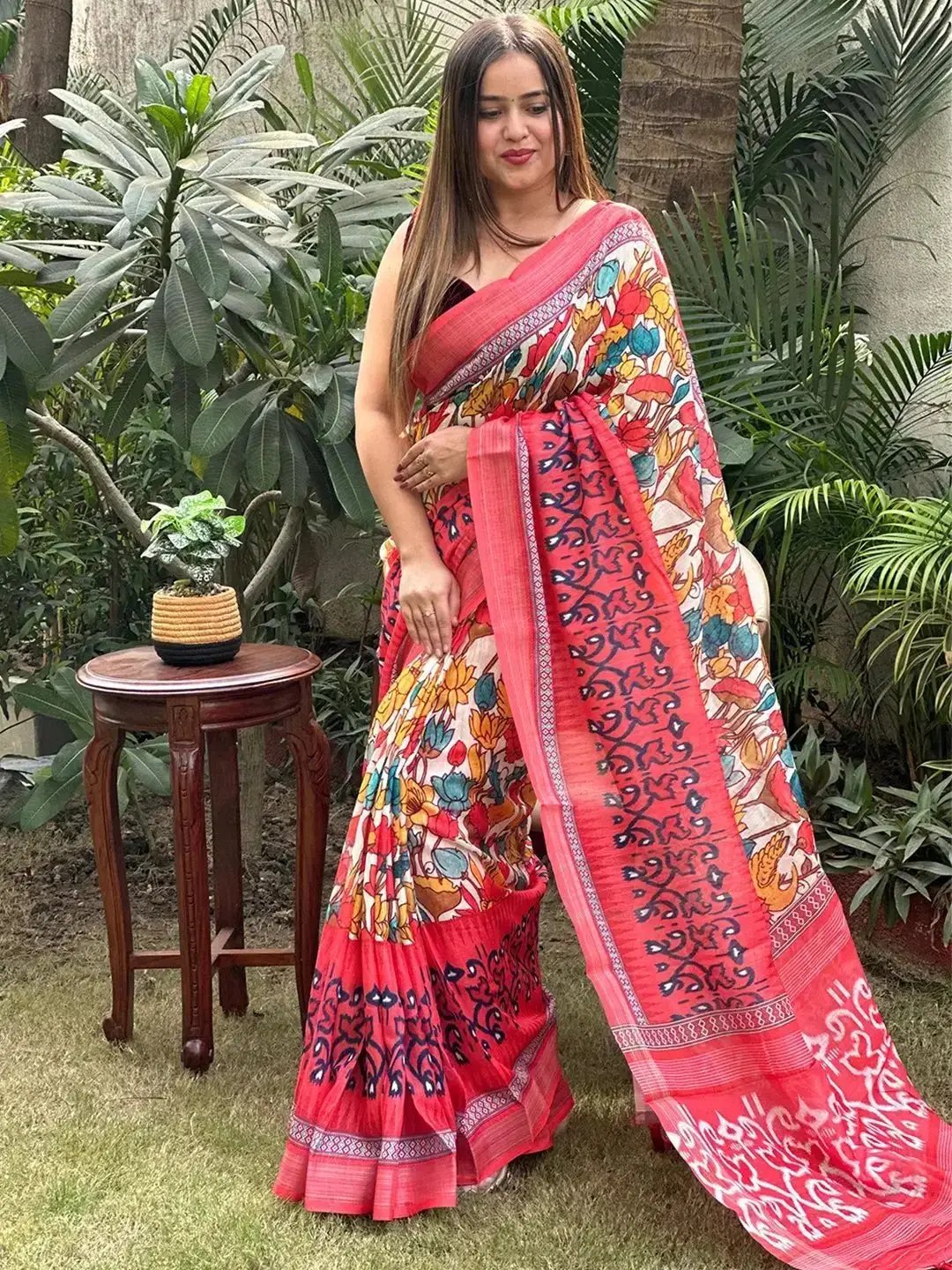 Vibrant Floral Ikkat Saree worn in outdoor garden