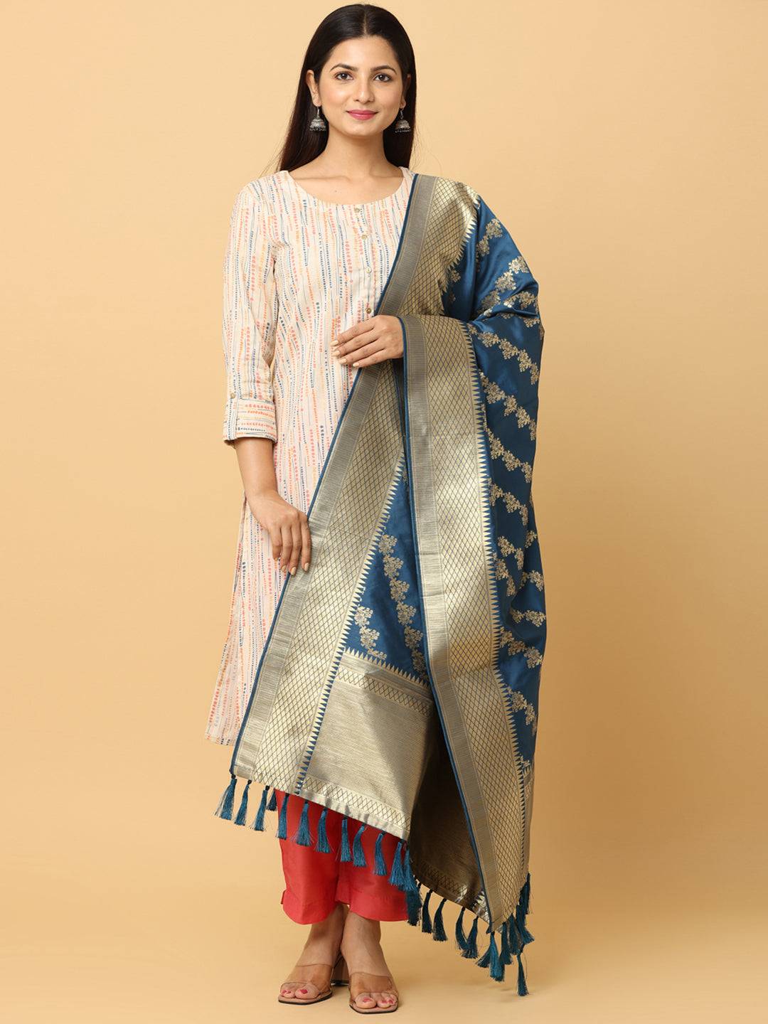 Front view of teal woven design dupatta with tassels