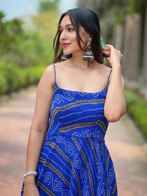 Close-up of Royal Blue Bandhej Dress with silver earrings