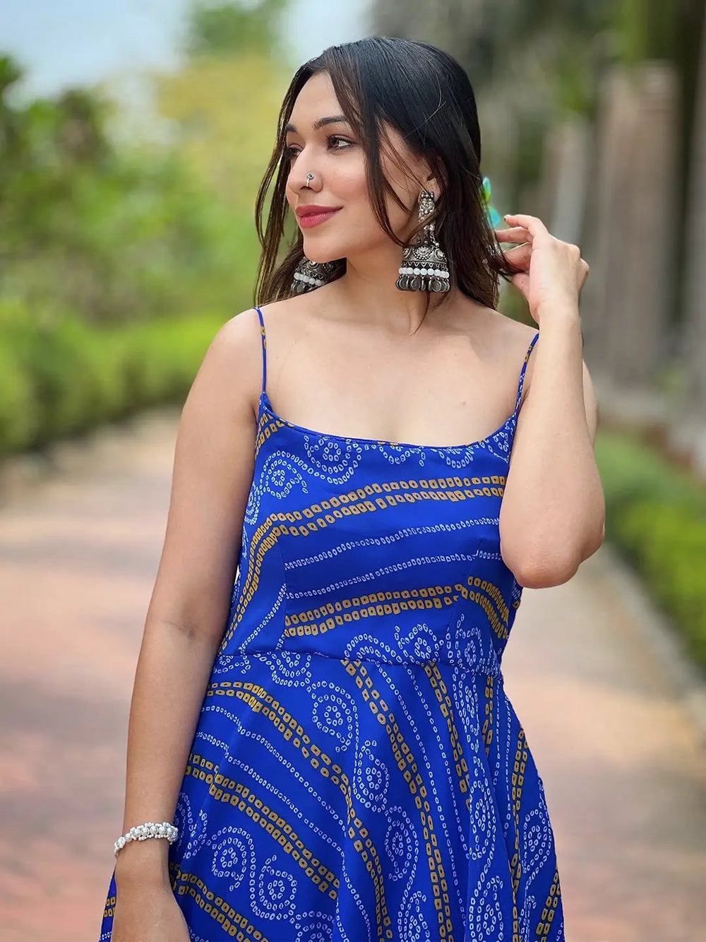 Close-up of Royal Blue Bandhej Dress with silver earrings