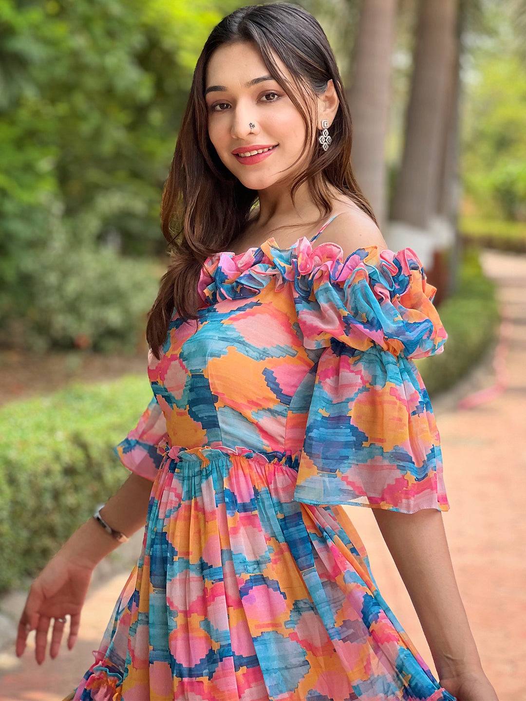 Close-up of frill neck dress in bold colors