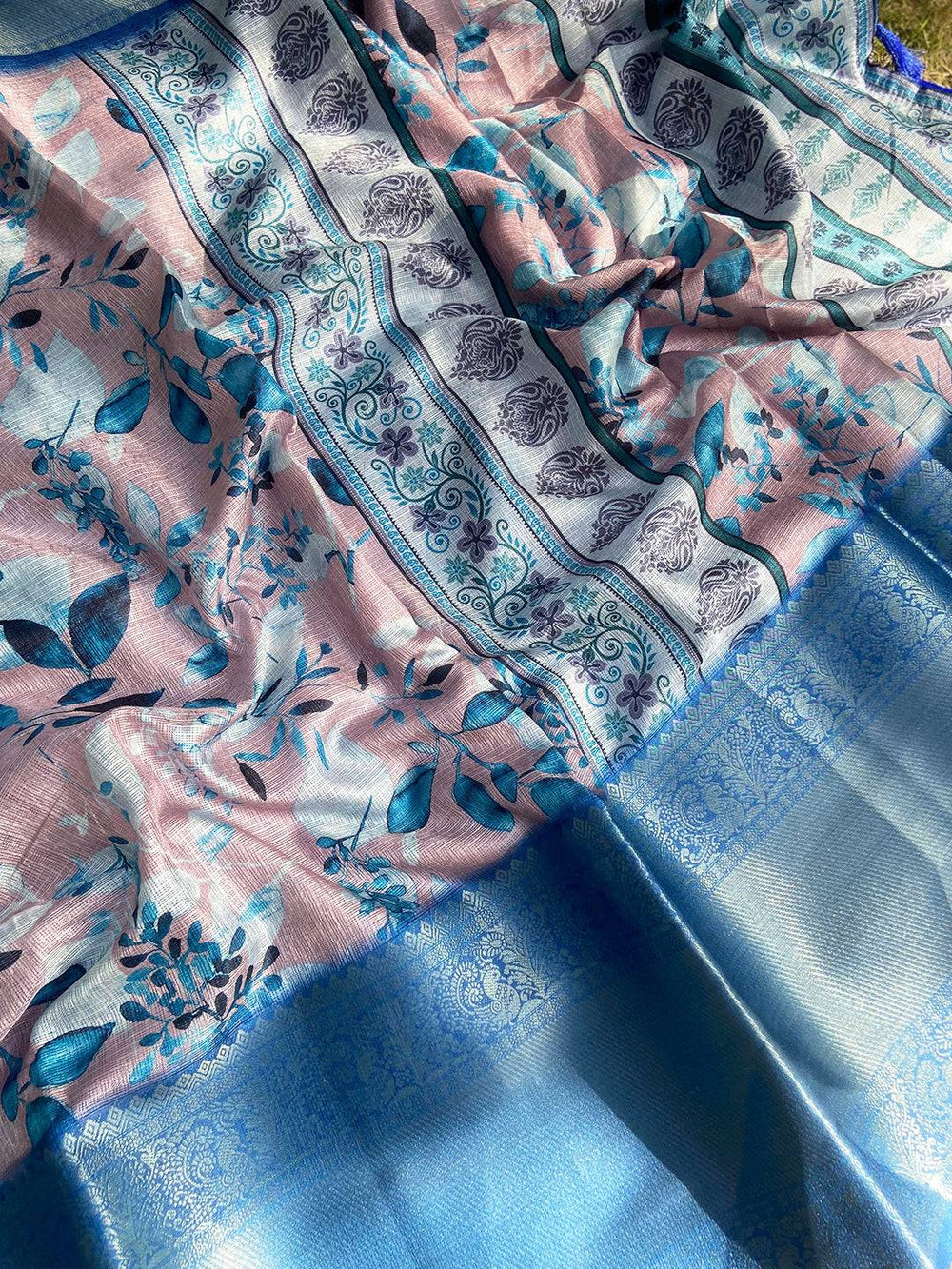Muvel Kota Doriya saree spread out showing floral and paisley motifs