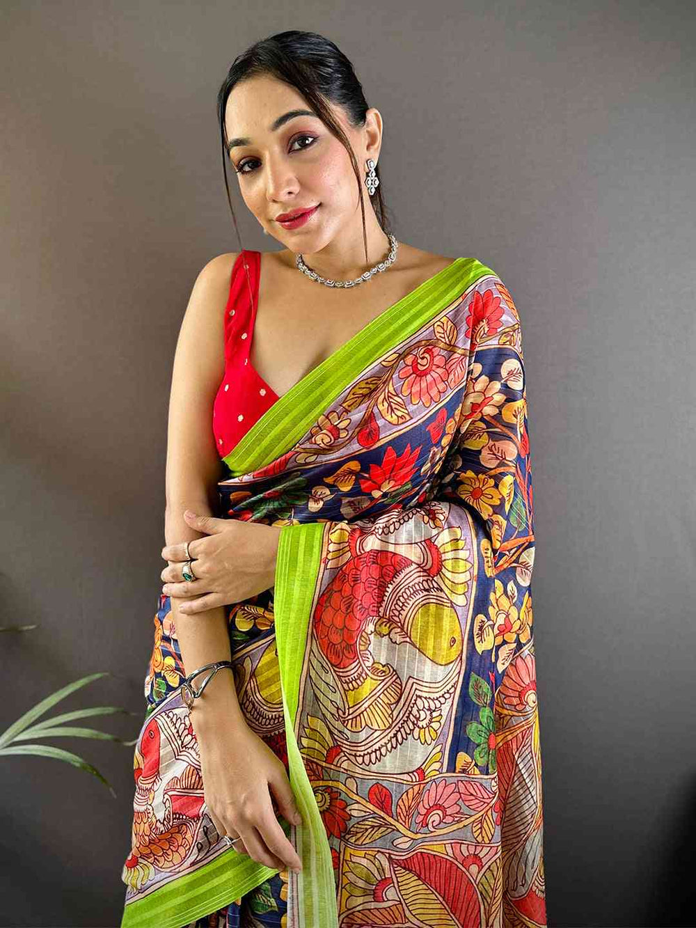 Model wearing Orchid Blue Pen Kalamkari Linen Saree with vibrant patterns