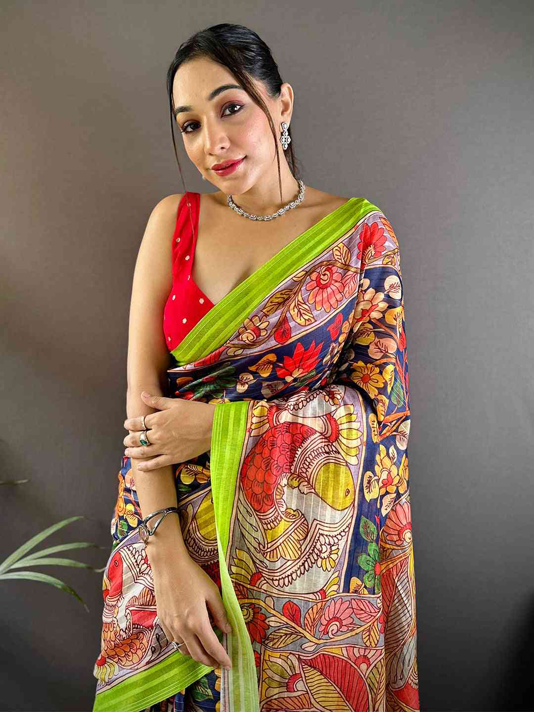 Model wearing Orchid Blue Pen Kalamkari Linen Saree with vibrant patterns
