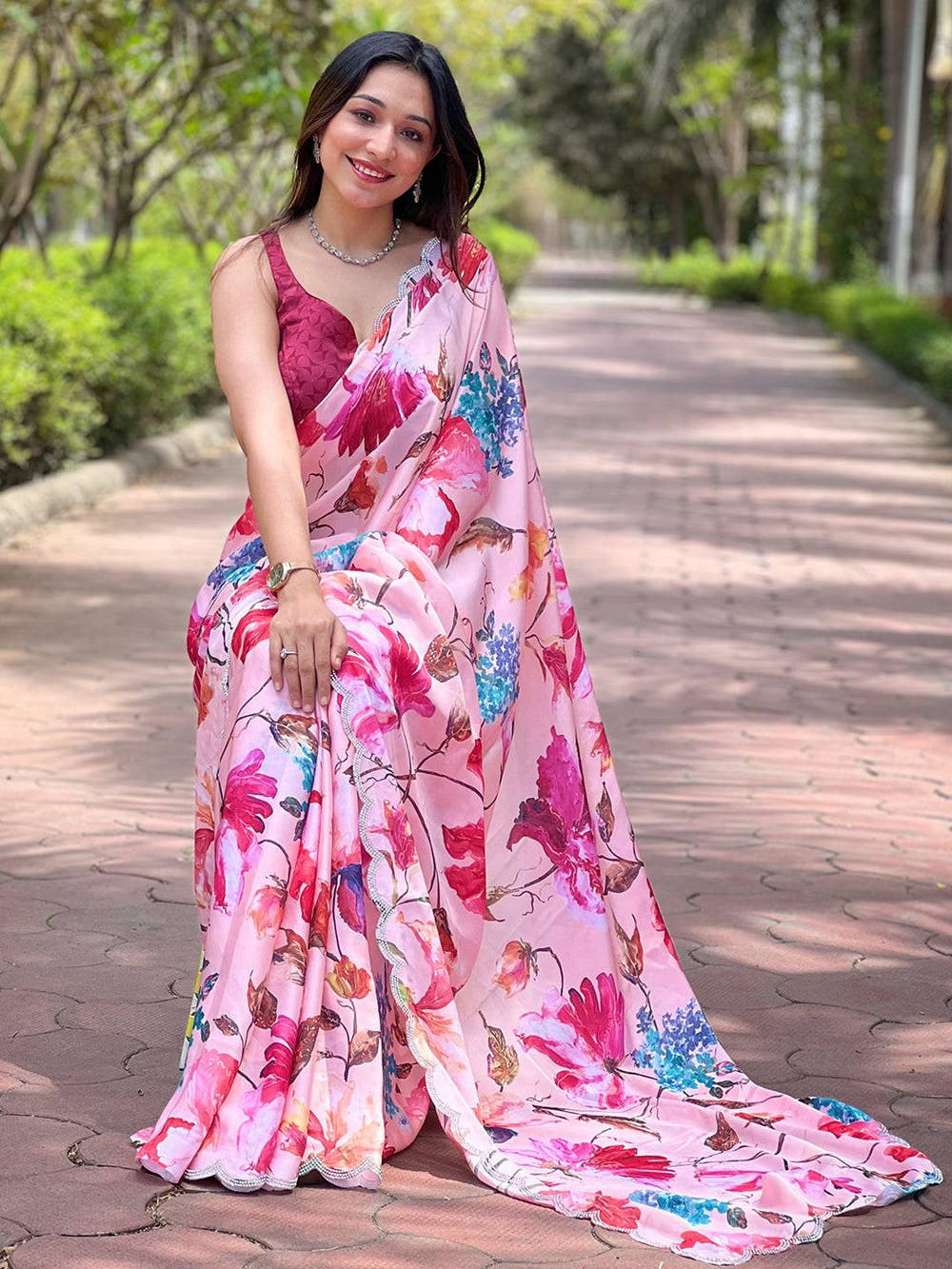 Peach satin georgette saree with vibrant floral design