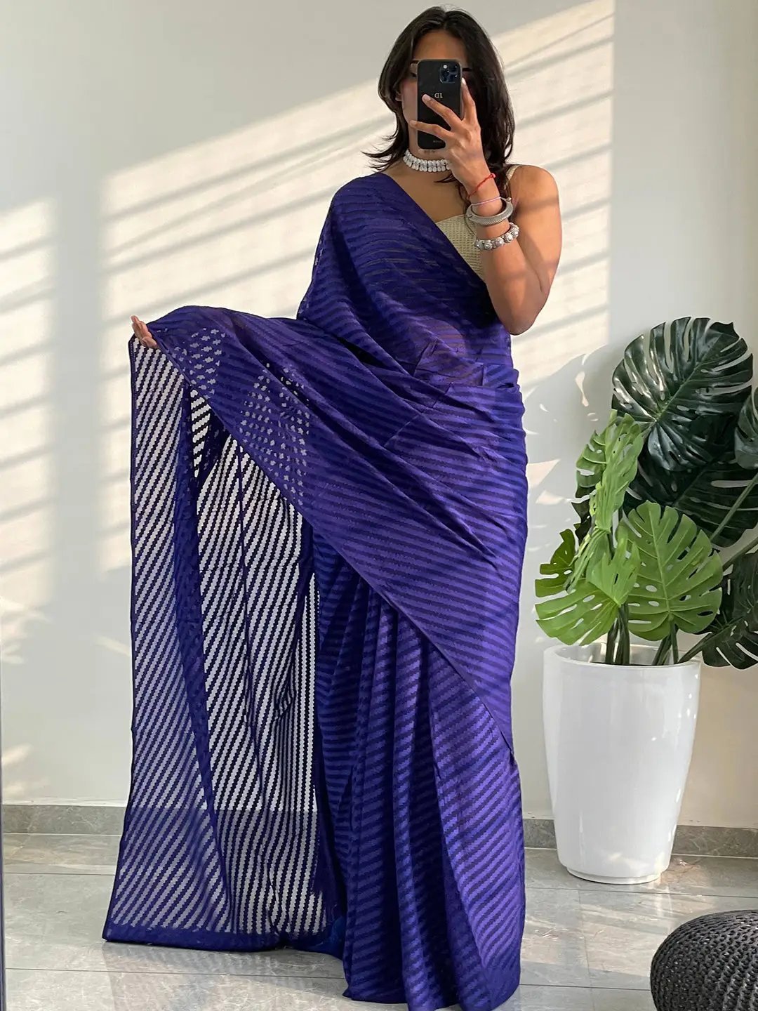 Blue georgette saree with detailed thread weaving pattern