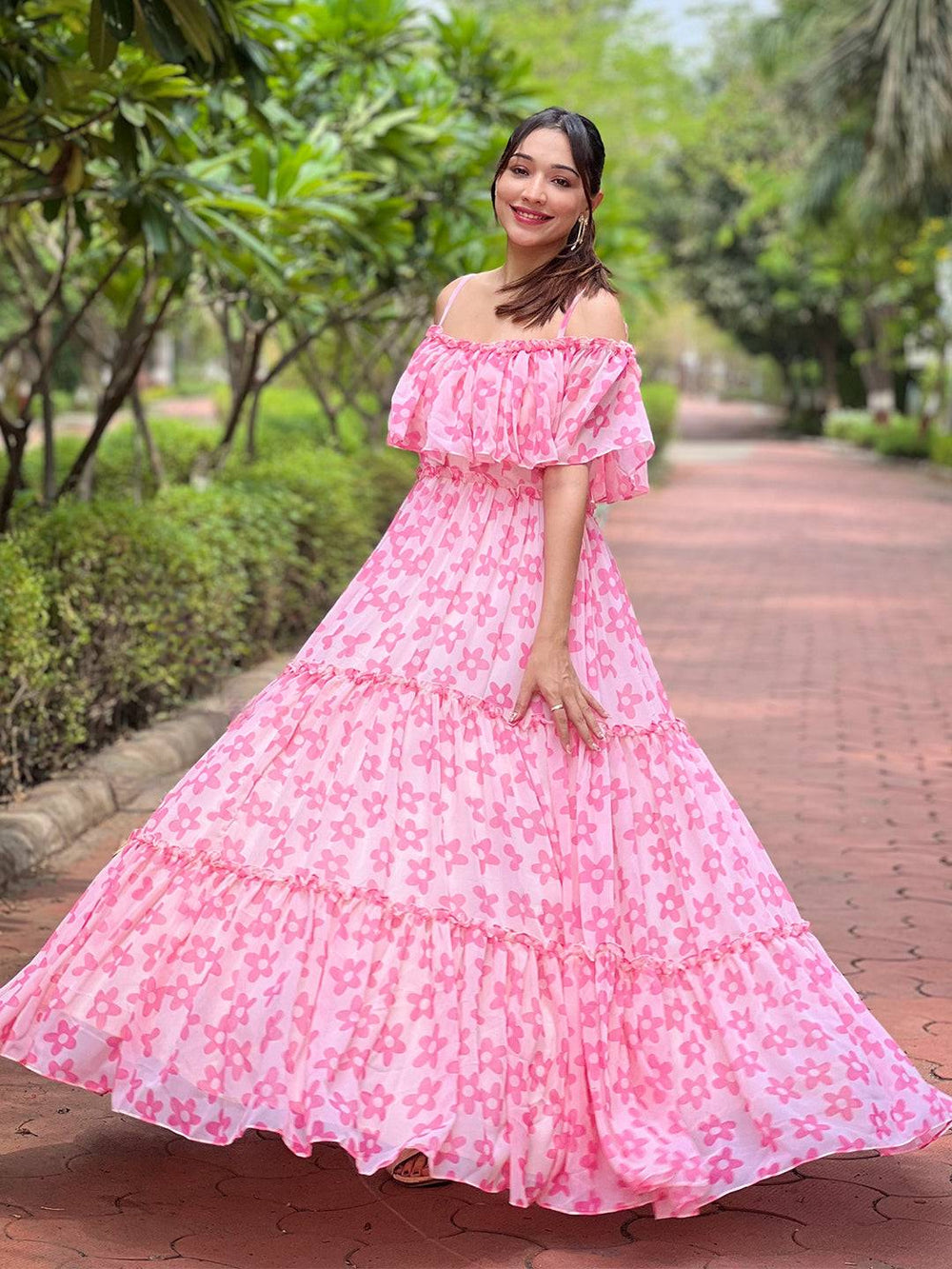 Pink rosette dress with tiered skirt and ruffles