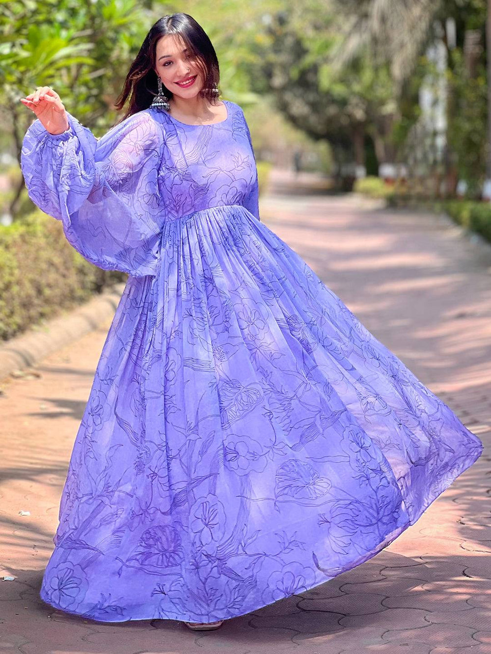 Flowing slate blue dress with puff sleeves in motion