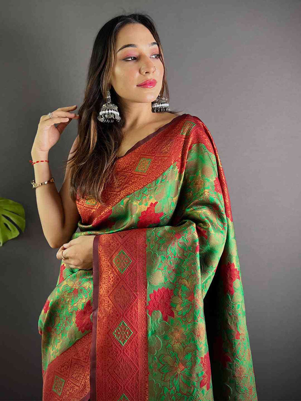 Model wearing Forest Green Soft Silk Butta Weaving Saree
