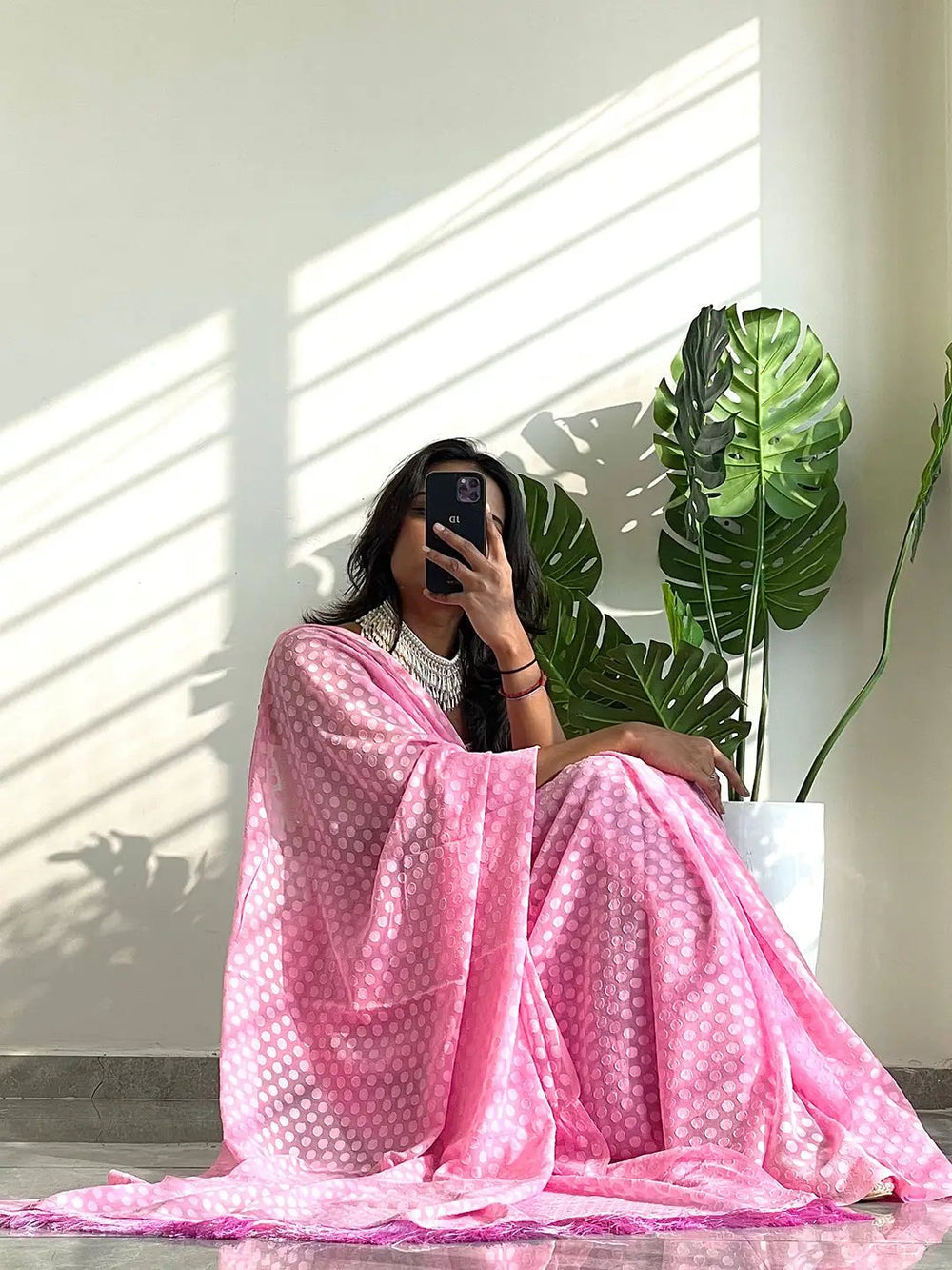 Elegant pink georgette saree with thread weaving, perfect for special events.