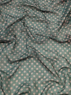 Close-up of Gajari Ikkat saree fabric with pattern