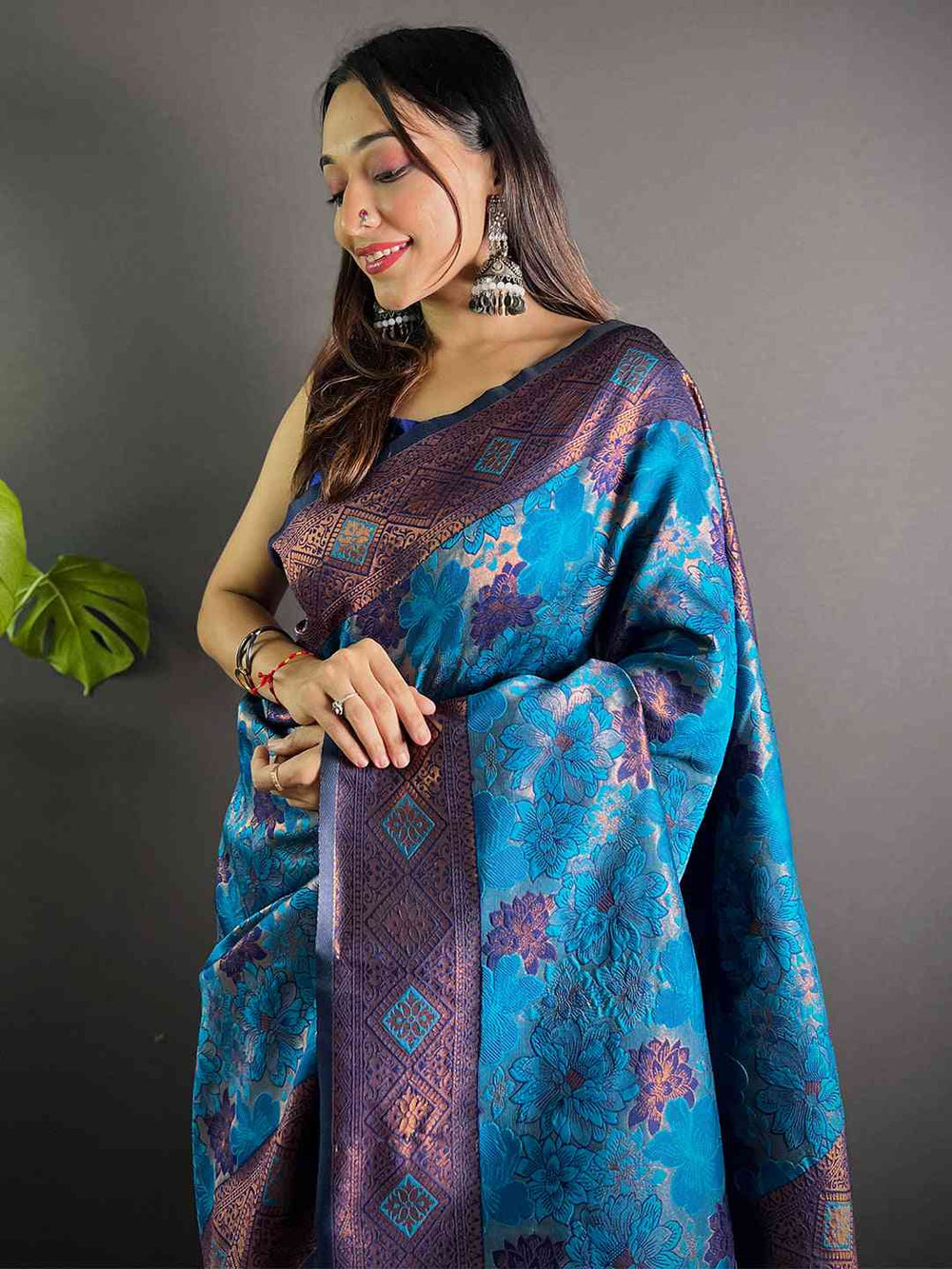 Model wearing royal blue soft silk butta weaving saree