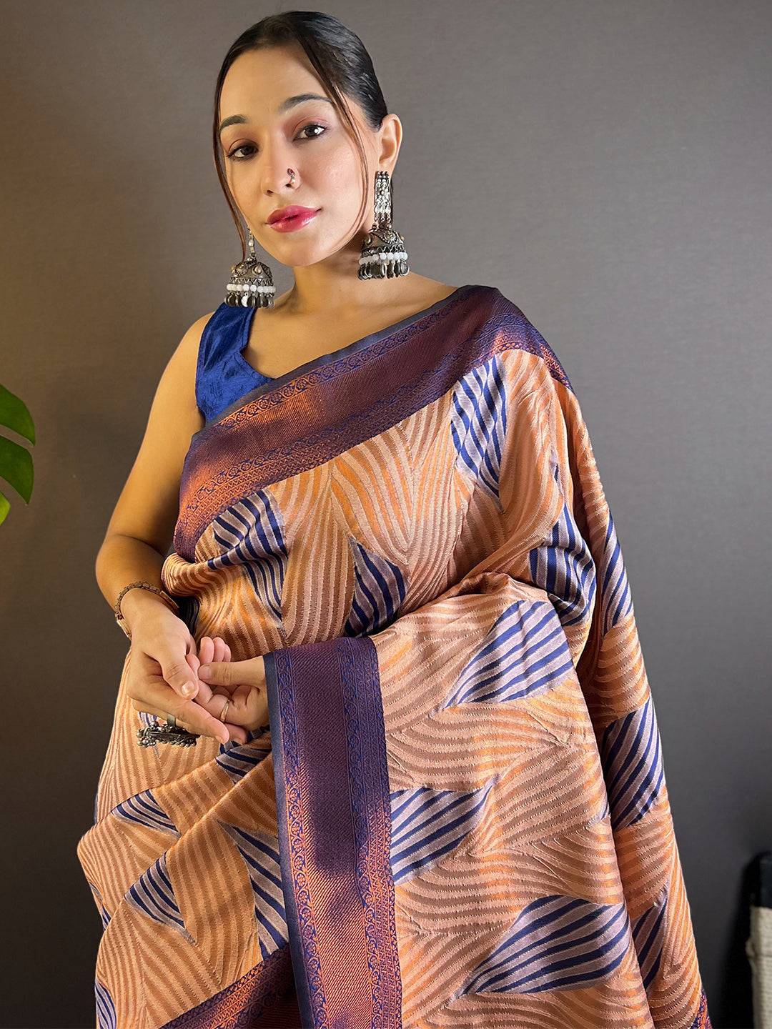 Model wearing Peach Tussar Silk Abstract Print Ikkat Saree