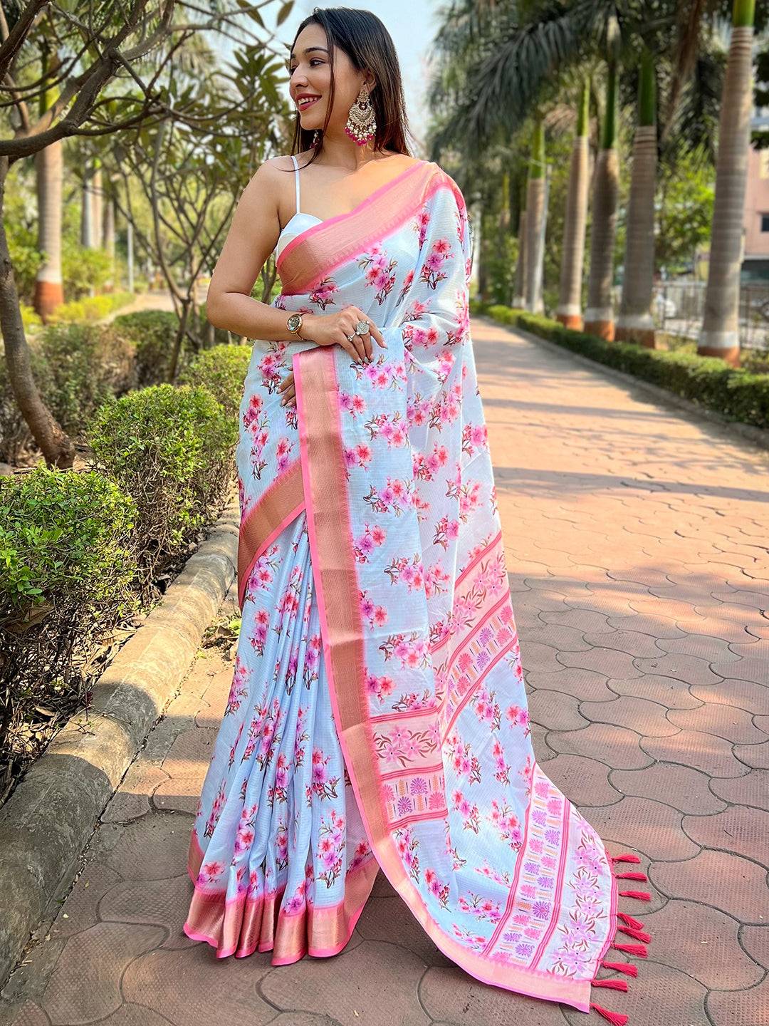 Light blue Kota saree with digital floral print, worn outdoors