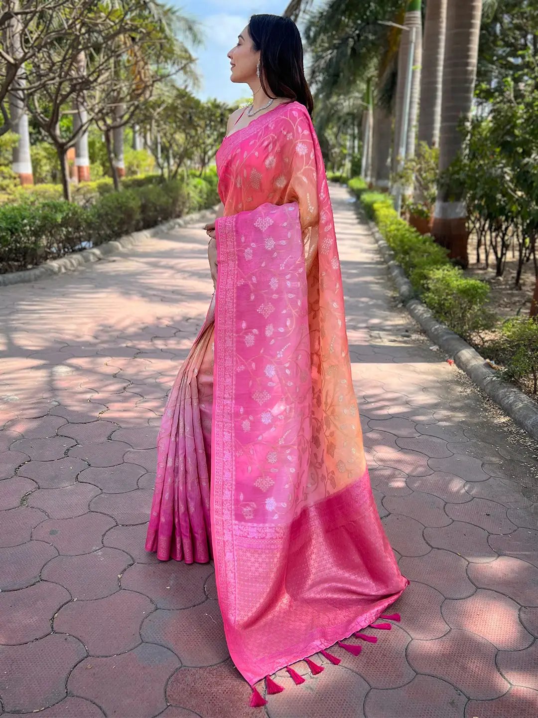 Side view of pink slub silk saree with intricate weaving