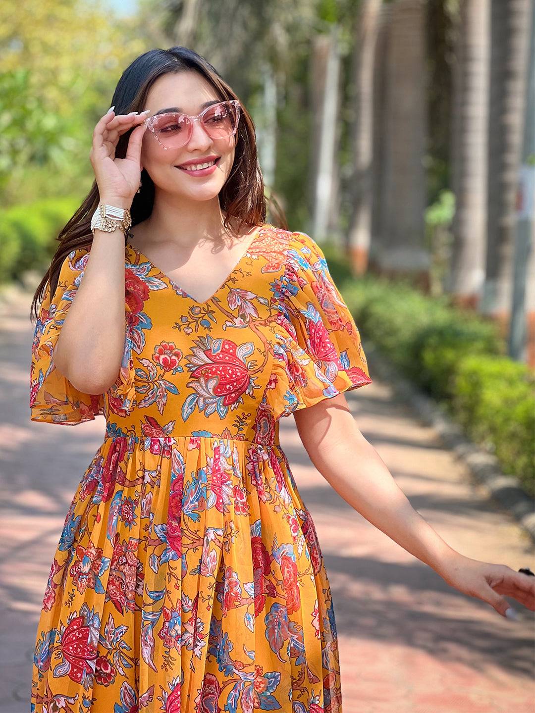 Close-up of Honey Yellow Chints Flower Dress with sunglasses