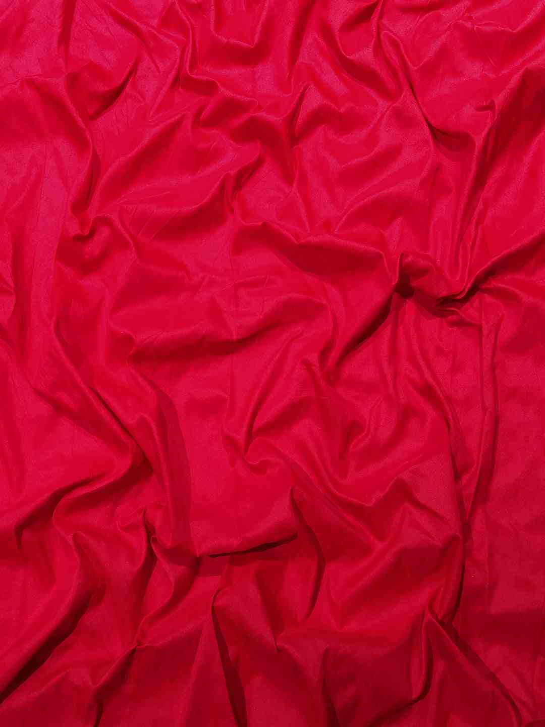Vibrant red fabric texture of Kanjivaram saree