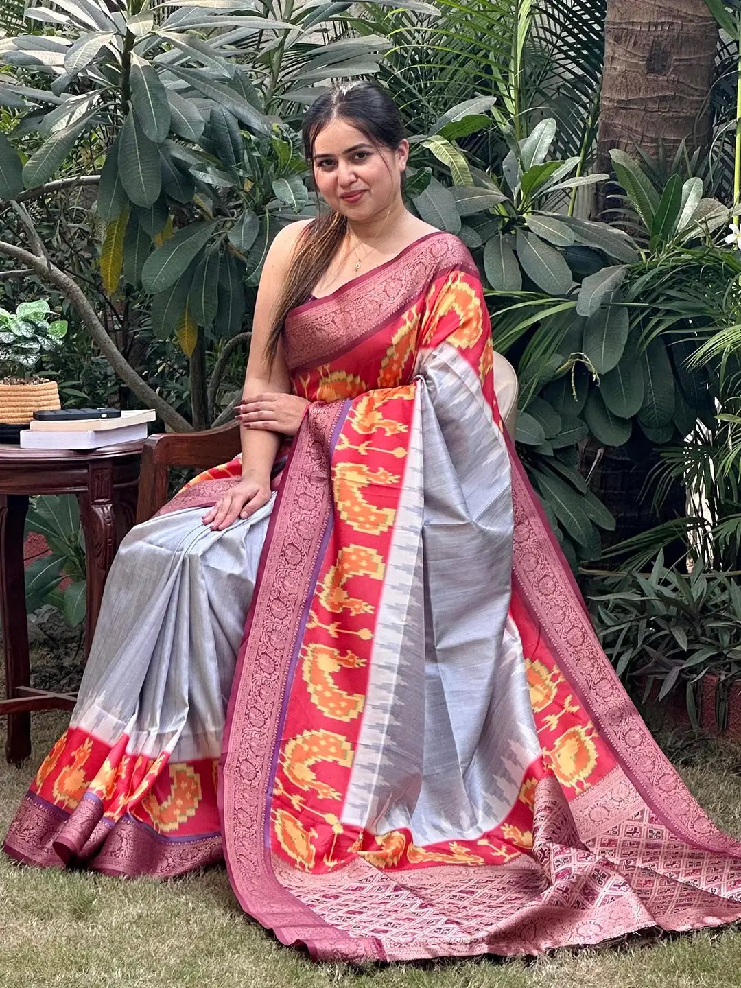 Elegant Banarasi soft silk saree with zari patola pallu in garden setting